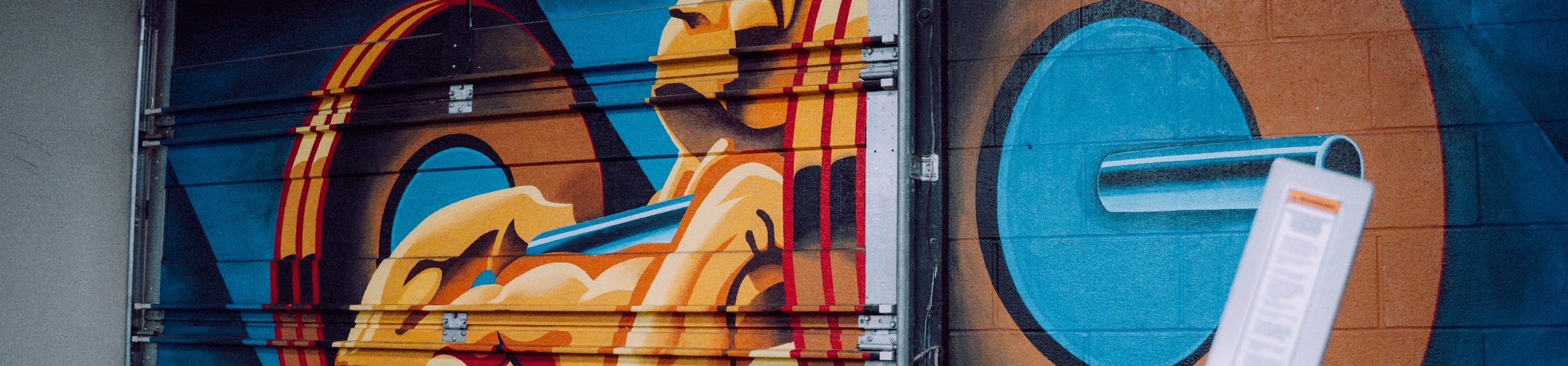The painted mural on the roll-up door